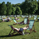 A woman relaxes on deckchairs in Green Park on May 25, 2017 in London, England.